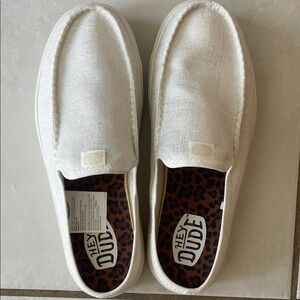 Like New Hey Dudes mule type shoe- worn one time. White metallic finish.